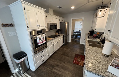 Fort Smith Casa | The Lily Pad. 3 bd/1ba. 4 beds. Center of town! Fenced backyard!