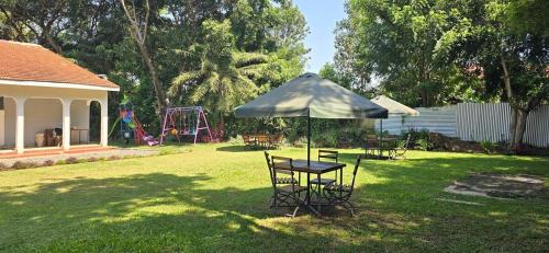 Kisumu Hotel | The lit garden place