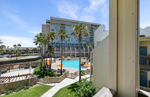 South Padre Island Casa | The ocean waves are calling! Relaxing setting with pool view in beachfront resort
