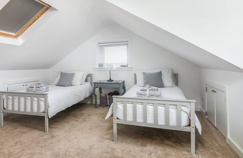 Kirkmichael Cabaña | The Rowans - una casa de vacaciones con capacidad para 9 personas en 4 habitaciones