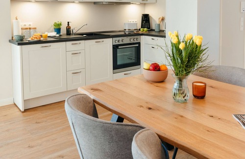 Ratzeburg Apartamento | The vacation apartment with large roof terrace is located in the forest on Ratzeburger Küchensee