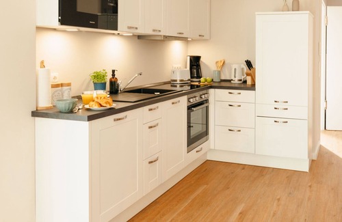 Ratzeburg Apartamento | The vacation apartment with large roof terrace is located in the forest on Ratzeburger Küchensee