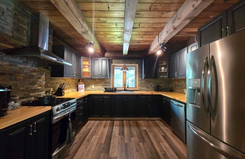 Lake St. Peter Cabaña | The Wooded Oasis - Cozy Winter Cottage w/Hot Tub & Sunken Firepit