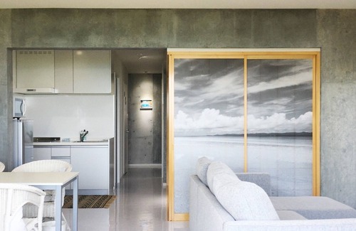 Higashionna Casa | Theme Suite 101 Overlooking the sea A modern mansion designed by an architect and a photographe / Uruma Okinawa