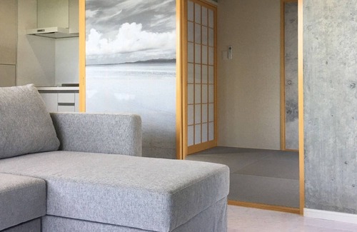 Higashionna Casa | Theme Suite 101 Overlooking the sea A modern mansion designed by an architect and a photographe / Uruma Okinawa