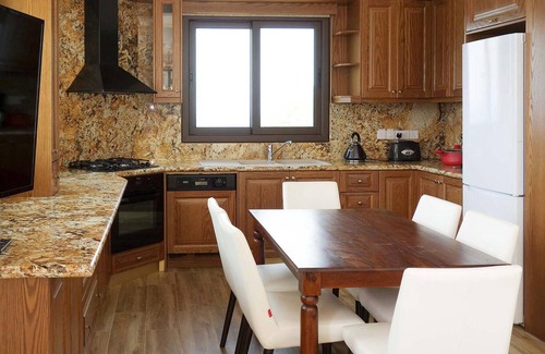 Pachyammos Casa | This attractive stone villa is set in an elevated position and commands wonderful views across the c