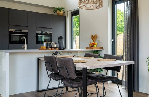 Ouddorp Casa | This attractively furnished holiday home with a large terrace, is located on a quiet family park and close to the sea and beach.