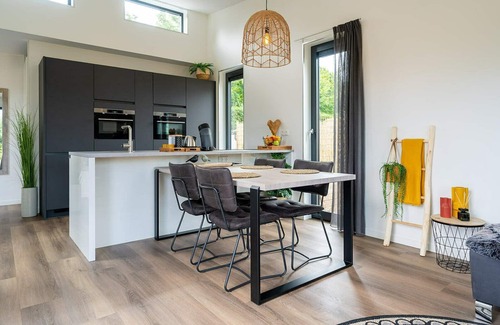Ouddorp Casa | This attractively furnished holiday home with a large terrace, is located on a quiet family park and close to the sea and beach.