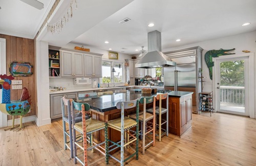 Debordieu Colony Casa | This vibrant family home features 8 bedrooms, and 8 bathrooms, ocean and creek views