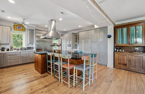 Debordieu Colony Casa | This vibrant family home features 8 bedrooms, and 8 bathrooms, ocean and creek views
