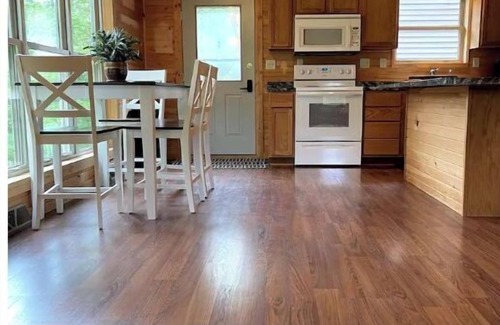 Westby Casa | Timber Coulee Creek in backyard, king size bed, grill on deck, large garage.