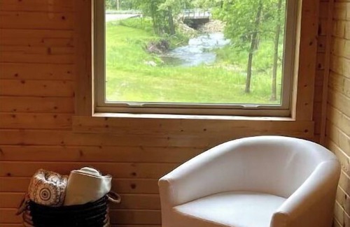 Westby Casa | Timber Coulee Creek in backyard, king size bed, grill on deck, large garage.