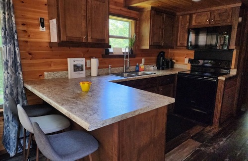 Mill Spring Casa | Tiny home on the creek, screened in porch, full kitchen, private firepit, sleeps 8