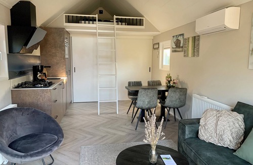 Lathum Casa | Tiny house time out at the lake and beach. Fenced garden, outdoor shower and fireplace.