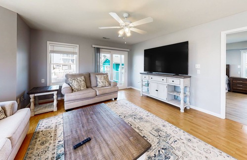 Cedar Neck Casa | Town of Ocean View canal-front home with dock, kayaks, balconies, grill, & AC