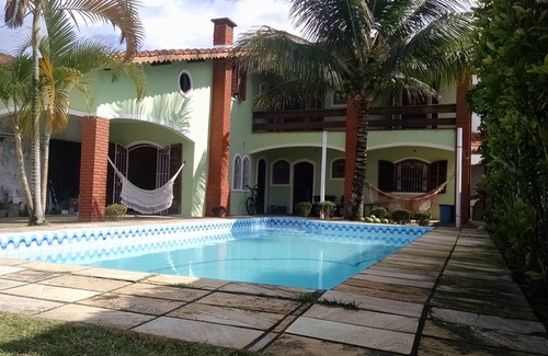 Balneario Arpoador Casa | Casa adosada con piscina a 500 metros de la playa con wifi gratis y TV por cable.