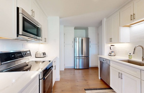 Gilford Casa | Tranquil lakeside retreat with beach access, pool, firepit, & lovely patio views