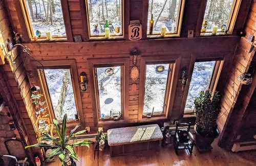 Raymond Casa | Tranquility, stone fireplace, lofted ceilings, wall of windows, & views