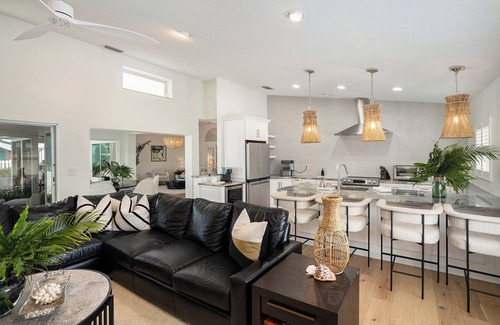 Capri Isle Casa | TREASURE ISLAND FLORIDA-- Discover your luxury 4 bedroom home on canal fishing