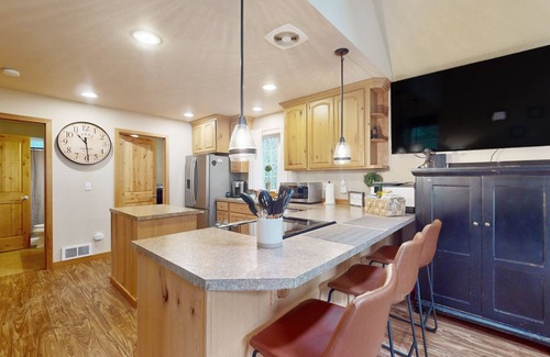 Anderson Island Casa | Tree-lined Anderson Island home with porch & fenced yard, near dock/tennis