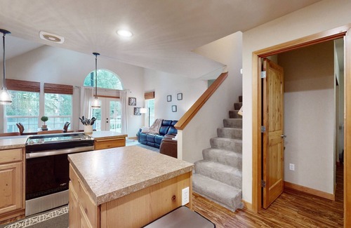 Anderson Island Casa | Tree-lined Anderson Island home with porch & fenced yard, near dock/tennis