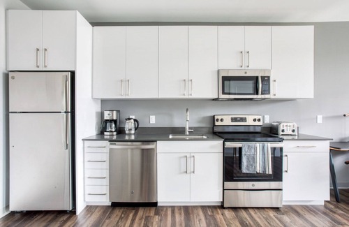 St. Elizabeth's Apartamento | Trendy Brighton 1BR w/ W/D, Gym, near T, Shops + Dining, by Blueground