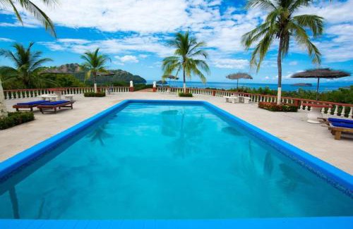 Coco Casa | Tropical Condo with Spectacular Ocean Views, Panoramic Dining Terrace & Quick Walk to Beach