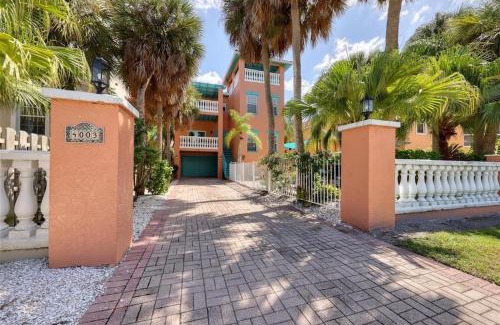 Holmes Beach Casa | Tropical luxury pool home by the beach with roof top lounge centrally located on Anna Maria Island