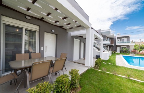 Paralia Ofryniou Villa | Two - Bedroom Loft with Pool Access, in Perla Residential Complex