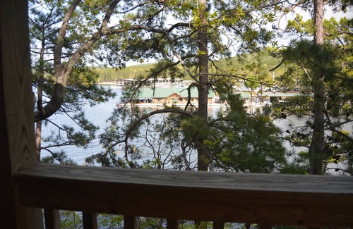 Mount Ida Cabaña | Two bedroom, two bath, log-sided, luxury Harbor North cottage overlooking Lake Ouachita. by RedAwning