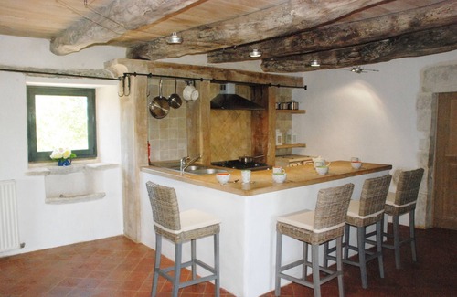 Ginals Casa | Two houses with a large swimming pool next to the ruins of a medieval castle