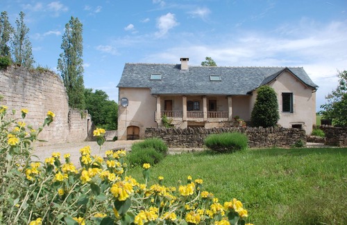 Ginals Casa | Two houses with a large swimming pool next to the ruins of a medieval castle