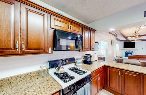 Capri Isle Casa | Two-story waterfront retreat with dock, pool, central AC, fireplace, & fast WiFi