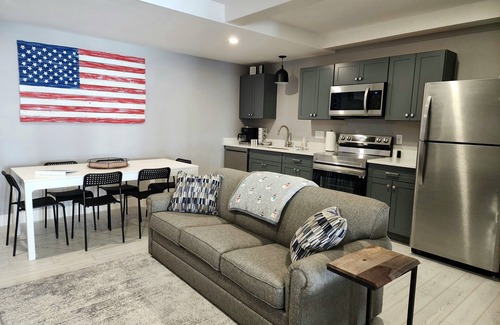 Mancelona Condominio | Unpack and relax with a Mountain view. New! Sleeps 6 Pools, New construction.