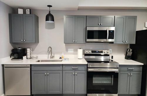 Mancelona Condominio | Unpack and relax with a Mountain view. New! Sleeps 6 Pools, New construction.