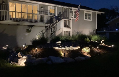 Ludington Casa | Upper level rental with large family room and huge wrap around deck full kitchen
