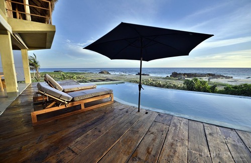 Santa María Tonameca Villa | UtopiAmar Las Palmas: a design beach room in a spectacular front beach setting.