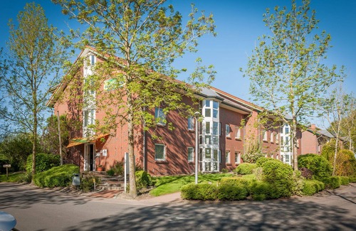 Wremen Apartamento | Vacation apartment Nordseebrise. Inviting and with balcony.