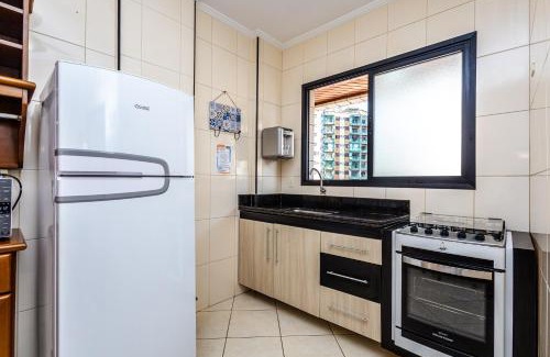 Tupi Apartamento | Vila Tupi-Praia Grande , 100 metros da praia, 2 quartos ,sendo uma suíte, Piscina , varanda com churrasqueira, garagem , Wi-Fi