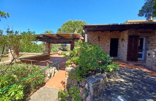Trinita d'Agultu e Vignola Casa | Villa La Lecceta surrounded by greenery and sea view with sunset
