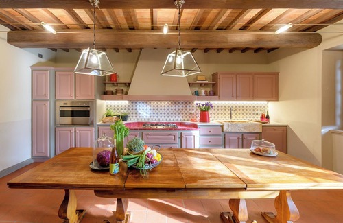 Torricella Villa | Villa Lago is set against a hillside of luscious greenery olive groves