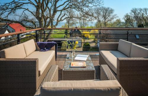 Breege Villa | Villa Lotsenhäuser Rügen - Luxus Ferienhaus - 3 Schlafzimmer - Sauna - Dachterrasse mit Boddenblick