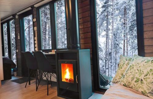 Muonio Chalet De Esquí | Visit Lapelland - Borealis Village with a Nature View, Fireplace, Sauna, Kitchen