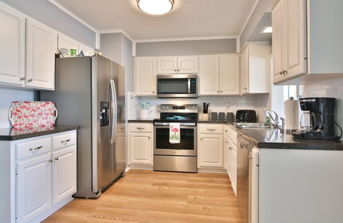 Shore Acre Heights Casa | Viva La Flamingo! Newly Furnished Home, 10 Min to Anna Maria, Heated Pool
