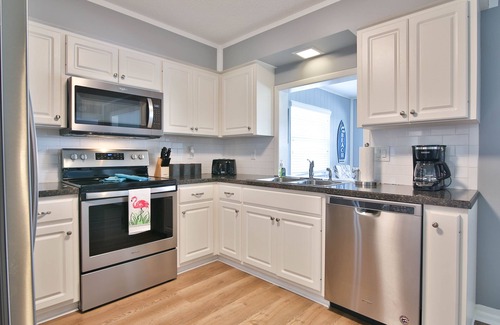Shore Acre Heights Casa | Viva La Flamingo! Newly Furnished Home, 10 Min to Anna Maria, Heated Pool