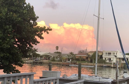 Capri Isle Casa | Watch sunsets from waterfront deck of 3,000 sq-ft. home in Tampa Bay beach town!