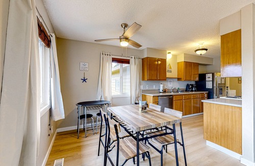 Bay City Casa | Water view retreat with scenic deck, grill, yard, fireplace, board games, & W/D