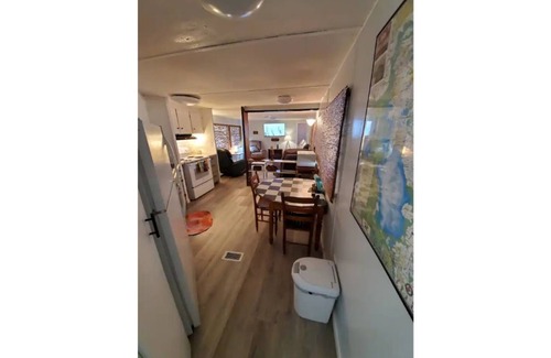 Satsuma Cabaña | Waterfront Boat House updated mobile home - Work & Fish on 50 ft. Dock and slips