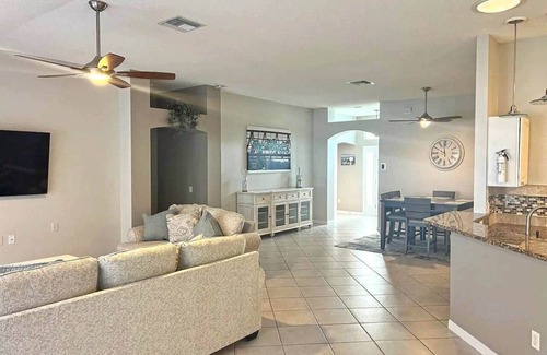 The Villages Casa | Premier home with Heated Pool, Waterfront, 2 king beds & 4 person golf cart.