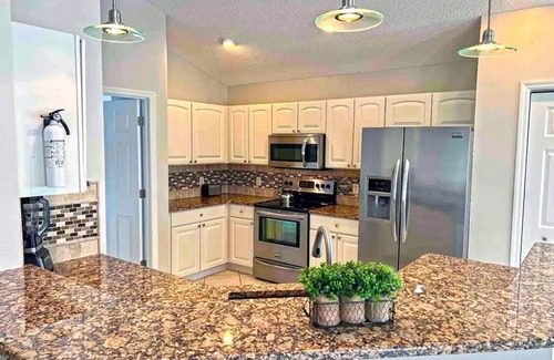 The Villages Casa | Premier home with Heated Pool, Waterfront, 2 king beds & 4 person golf cart.